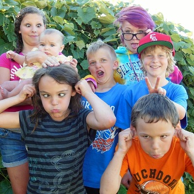 Cousins gathered for a picture at thier Grandma Val's house. Olivia, Chloe,Dylan, Morgan, Maggie, Lilly and Ian enjoy making the "crazy faces" at the 4th of July family BBQ.