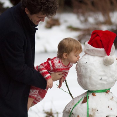 June Engerbretson says Snowman needs a kiss.
    - Dec 25, 2020
    - Eric & Sylvia Engerbretson's front yard, Moscow ID
    - Eric Engerbretson, (June's grandpa) photographer
    - Alec Engerbretson, 23, June Engerbretson, 2, both of Moscow, parents Alec & Hannah