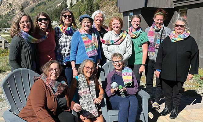 Lisa Sewell (bottom row, center) is the organizer of a weekly knitting group at Coffee Garden. - COURTESY PHOTO